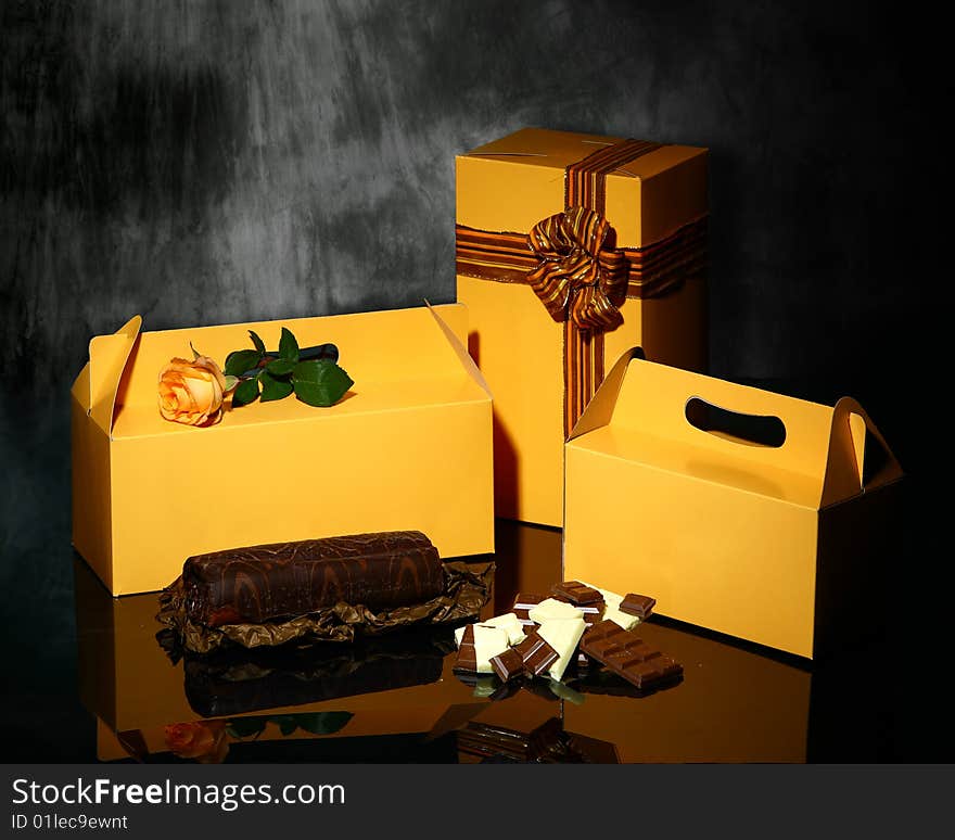 Boxes for cake and roll on dark background. Boxes for cake and roll on dark background