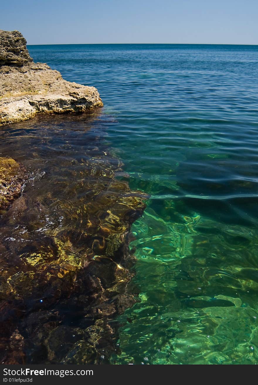 Big stones in the clearest sea water. Big stones in the clearest sea water.