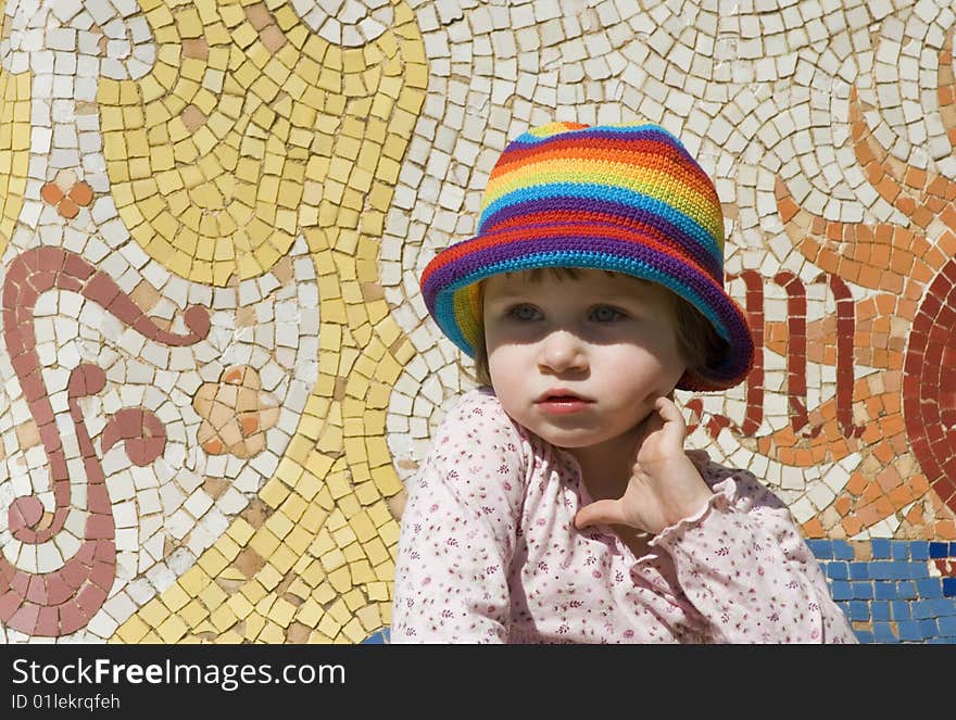 Portrait of a sweet girl with colourful mosaic