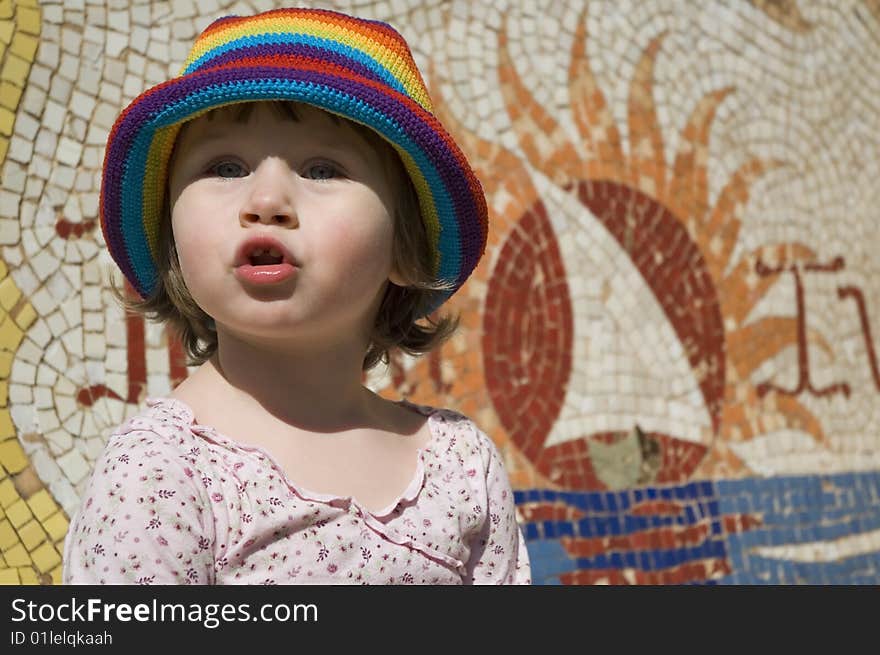 Portrait of a sweet girl with colourful mosaic