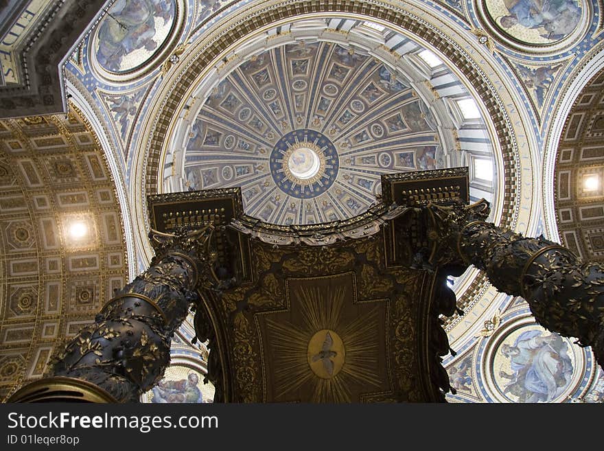 An image of Saint Peter cathedral's interior with sculpted bronze canopy designed by Gian Lorenzo Bernini. An image of Saint Peter cathedral's interior with sculpted bronze canopy designed by Gian Lorenzo Bernini