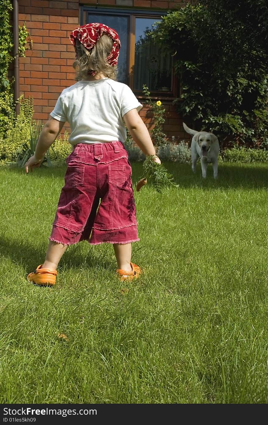 Little girl with best friend and carrot