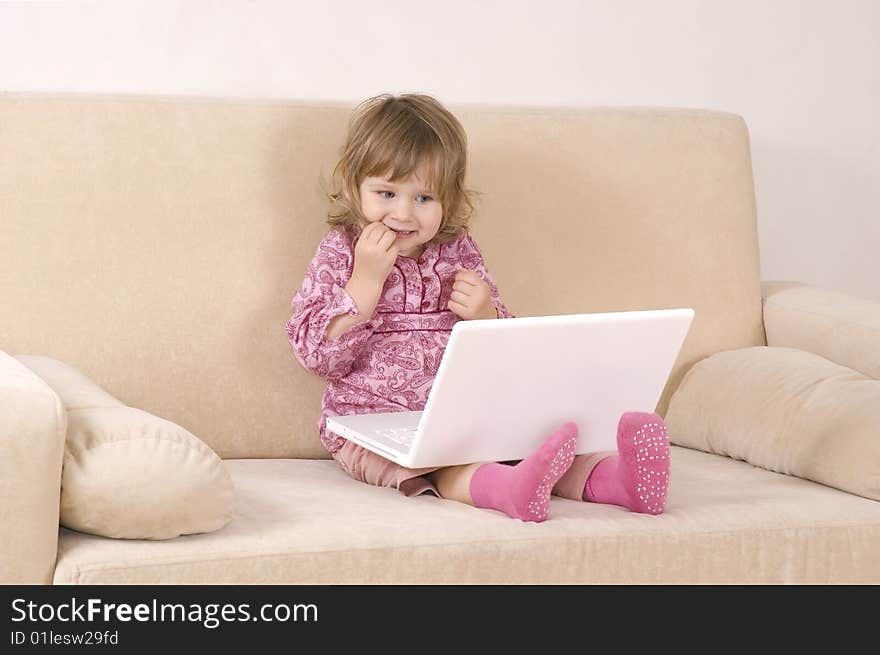 Young girl using a laptop. computer generation