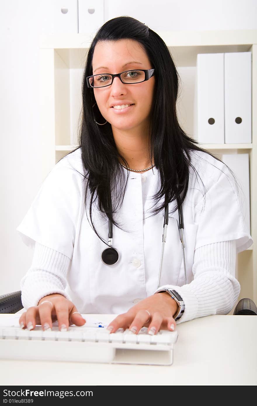 Beautiful young doctor in doctor's office