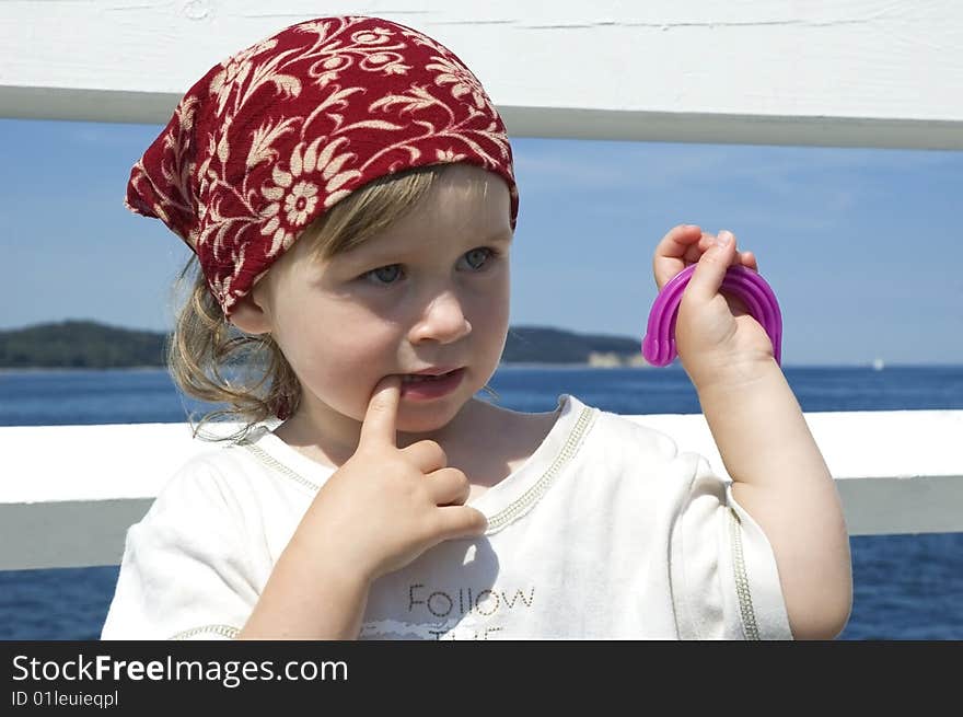 Beach day. little girl looking at the water. Beach day. little girl looking at the water