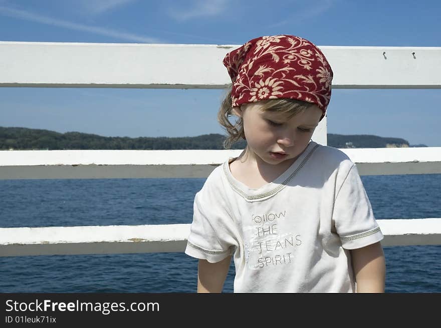 Beach day. little girl looking at the water. Beach day. little girl looking at the water