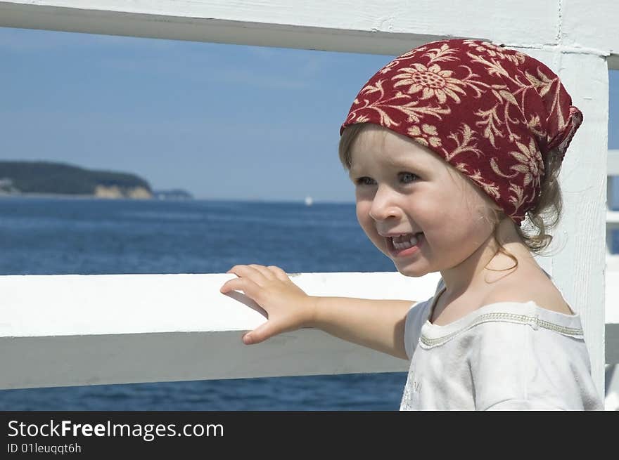 Beach day. little girl looking at the water. Beach day. little girl looking at the water