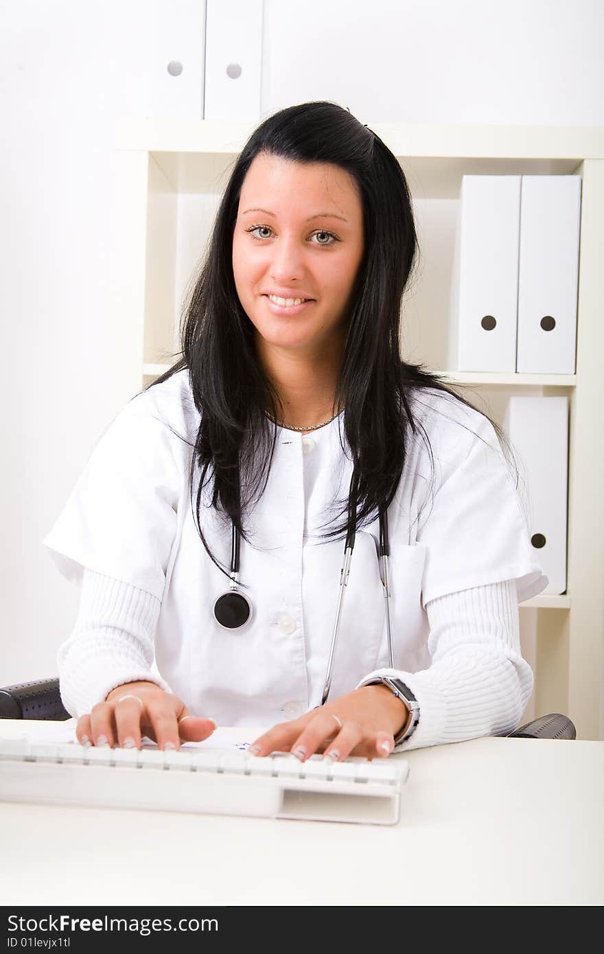 Beautiful young doctor in doctor's office