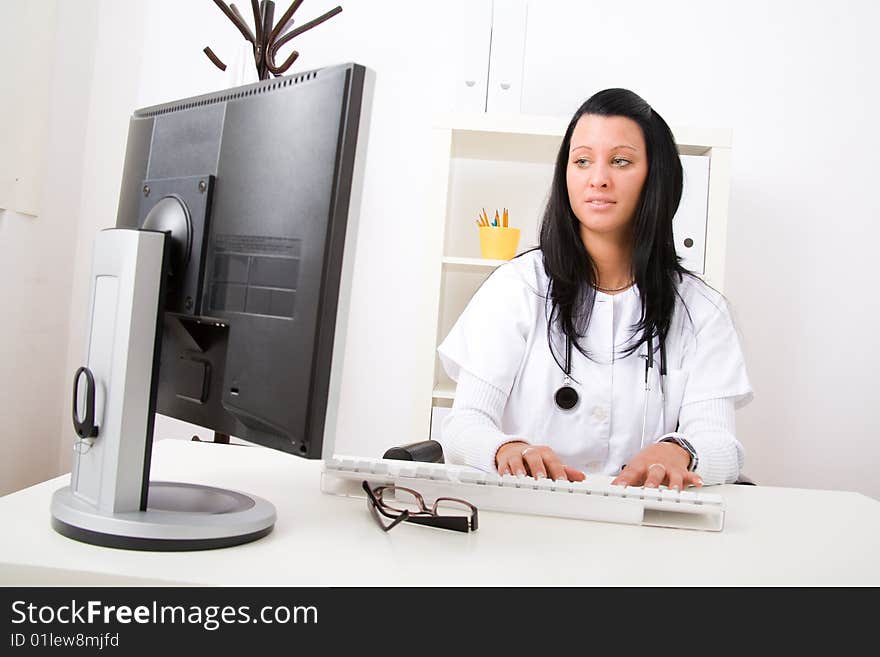 Beautiful young doctor in doctor's office