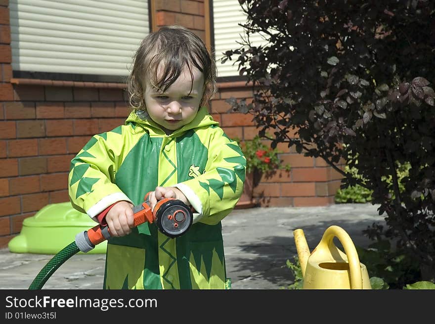 Girl watering the garden. water fight