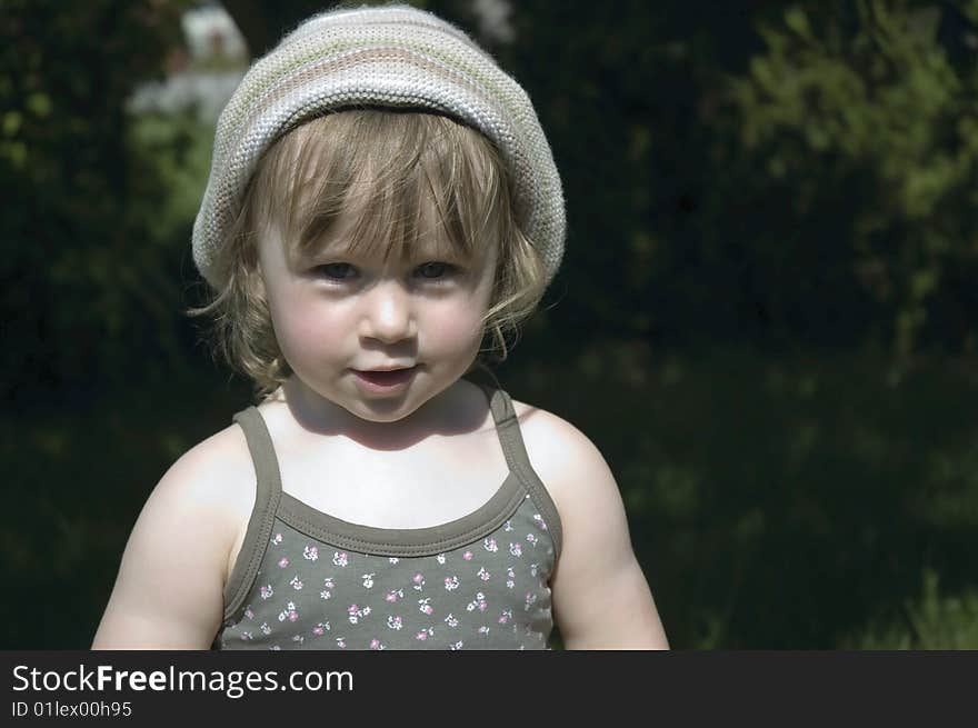 Smiling young girl in garden. Smiling young girl in garden