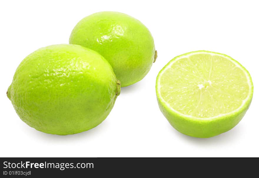 Fresh green limes isolated over white with clipping path