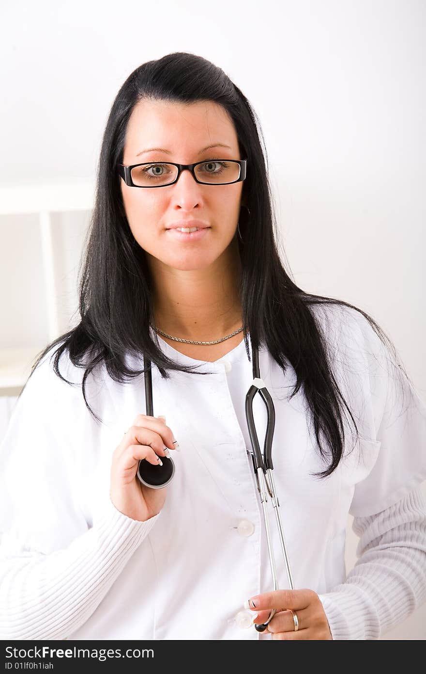 Beautiful young doctor in doctor's office