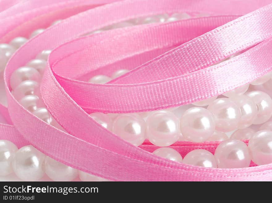 Pearls and satin pink ribbon. Pearls and satin pink ribbon