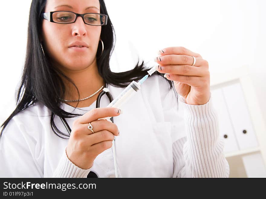 Beautiful young doctor in doctor's office