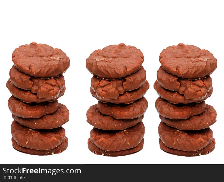 Shot of three piles of biscuits on white