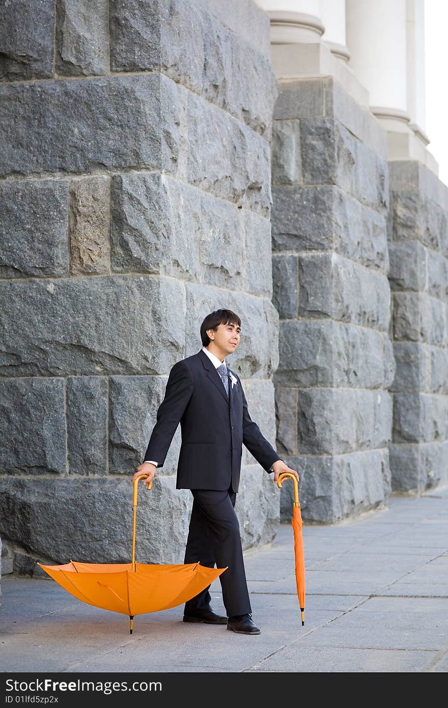 Groom with umbrella