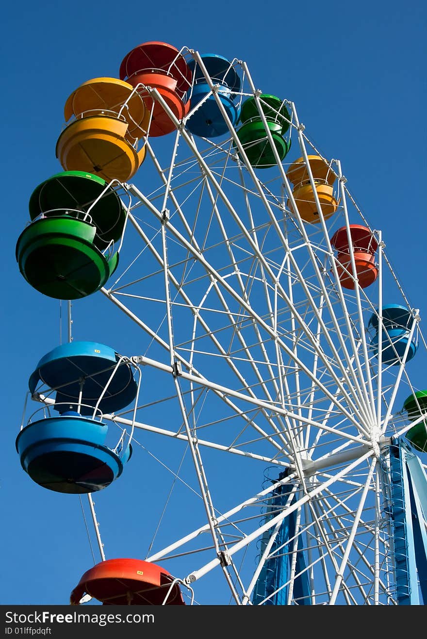 Big wheel against the blue sky. Big wheel against the blue sky