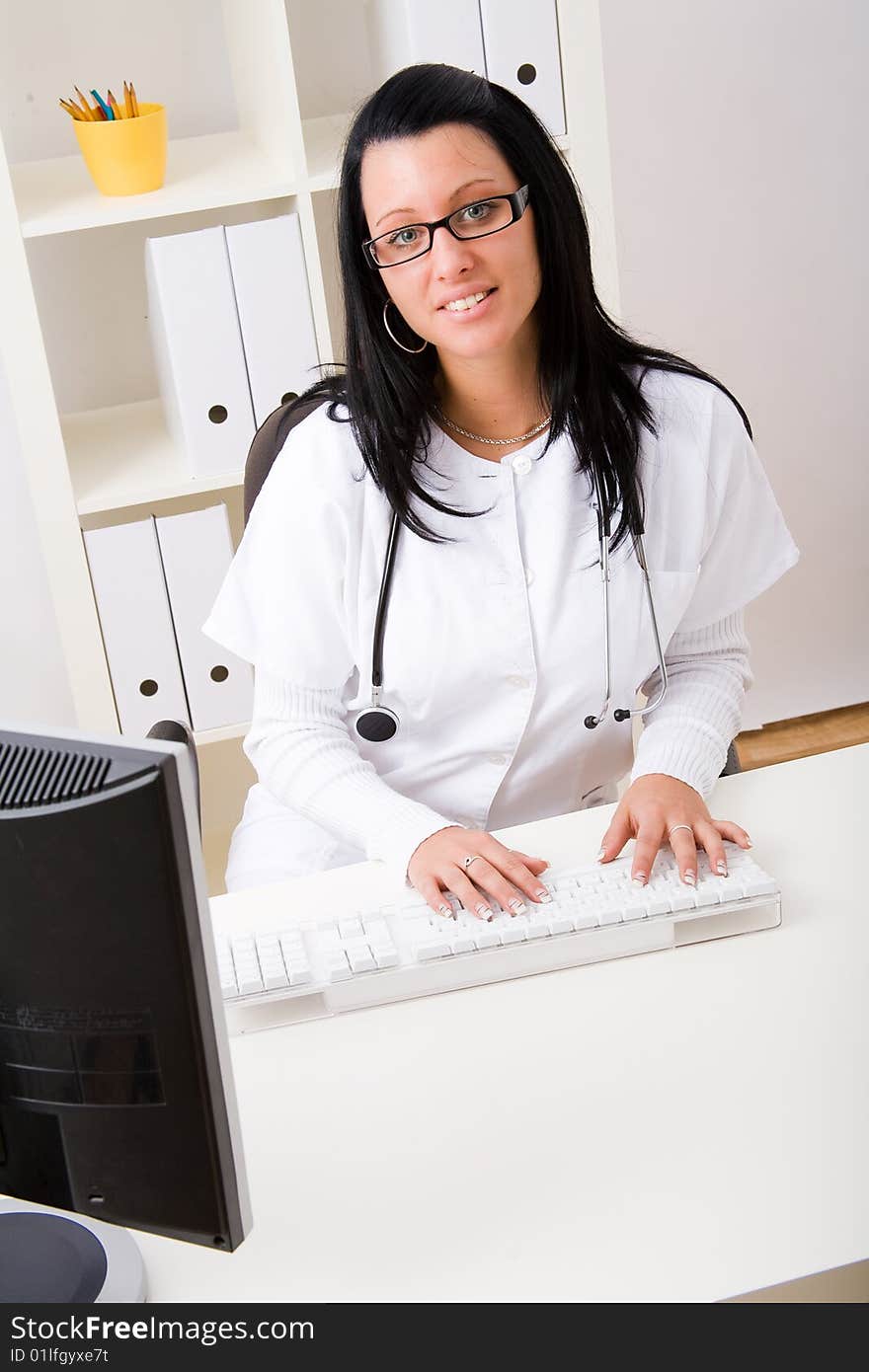 Beautiful young doctor in doctor's office