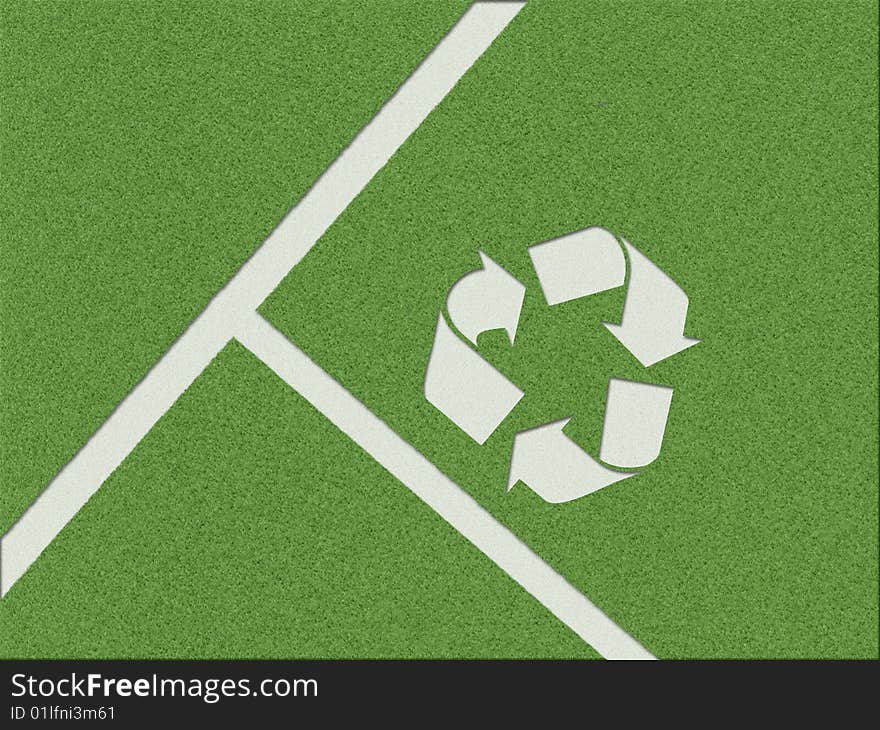 Recycling symbol on the grass