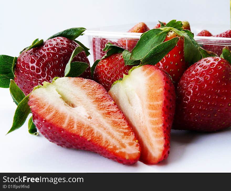 Some strawberries in and out bowl