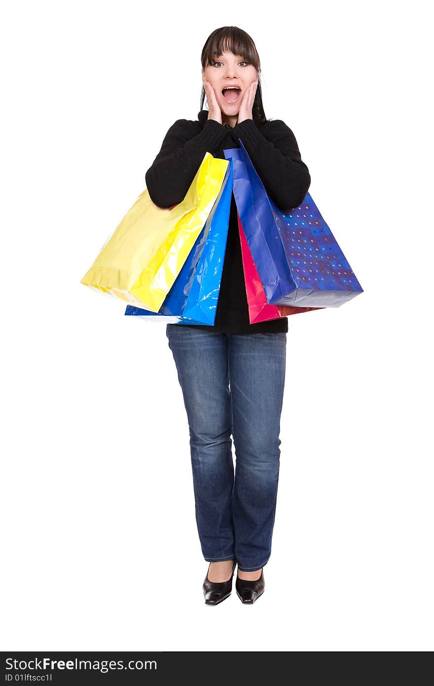 Happy brunette woman with shoping bags. over white background. Happy brunette woman with shoping bags. over white background