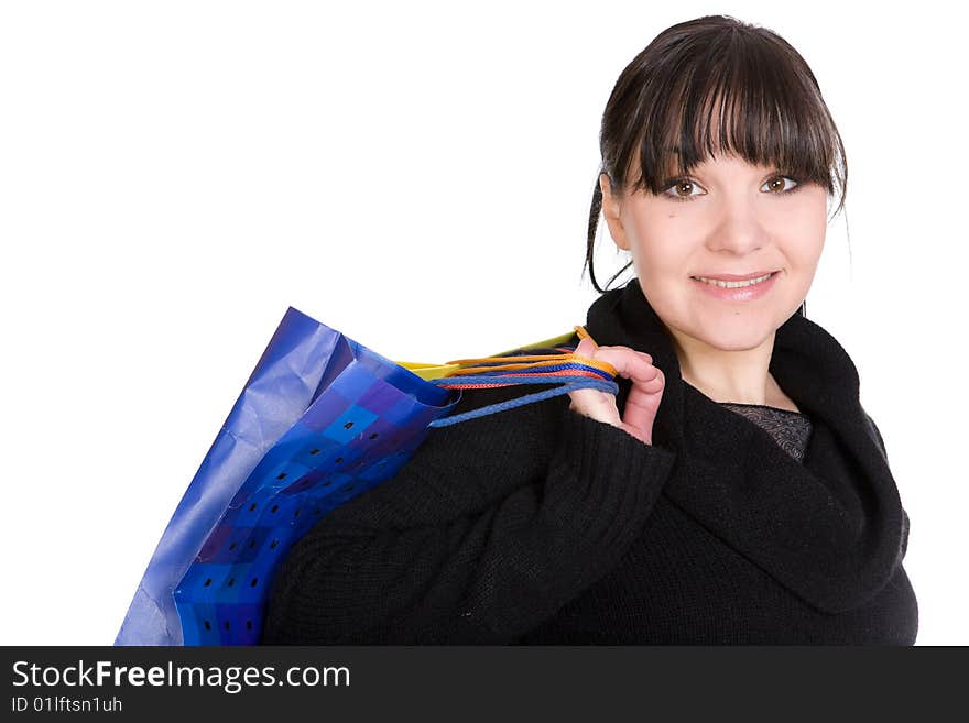 Happy brunette woman with shoping bags. over white background. Happy brunette woman with shoping bags. over white background