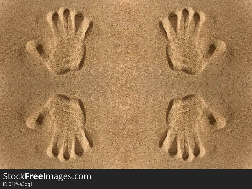 Close-up of hand imprints in sand