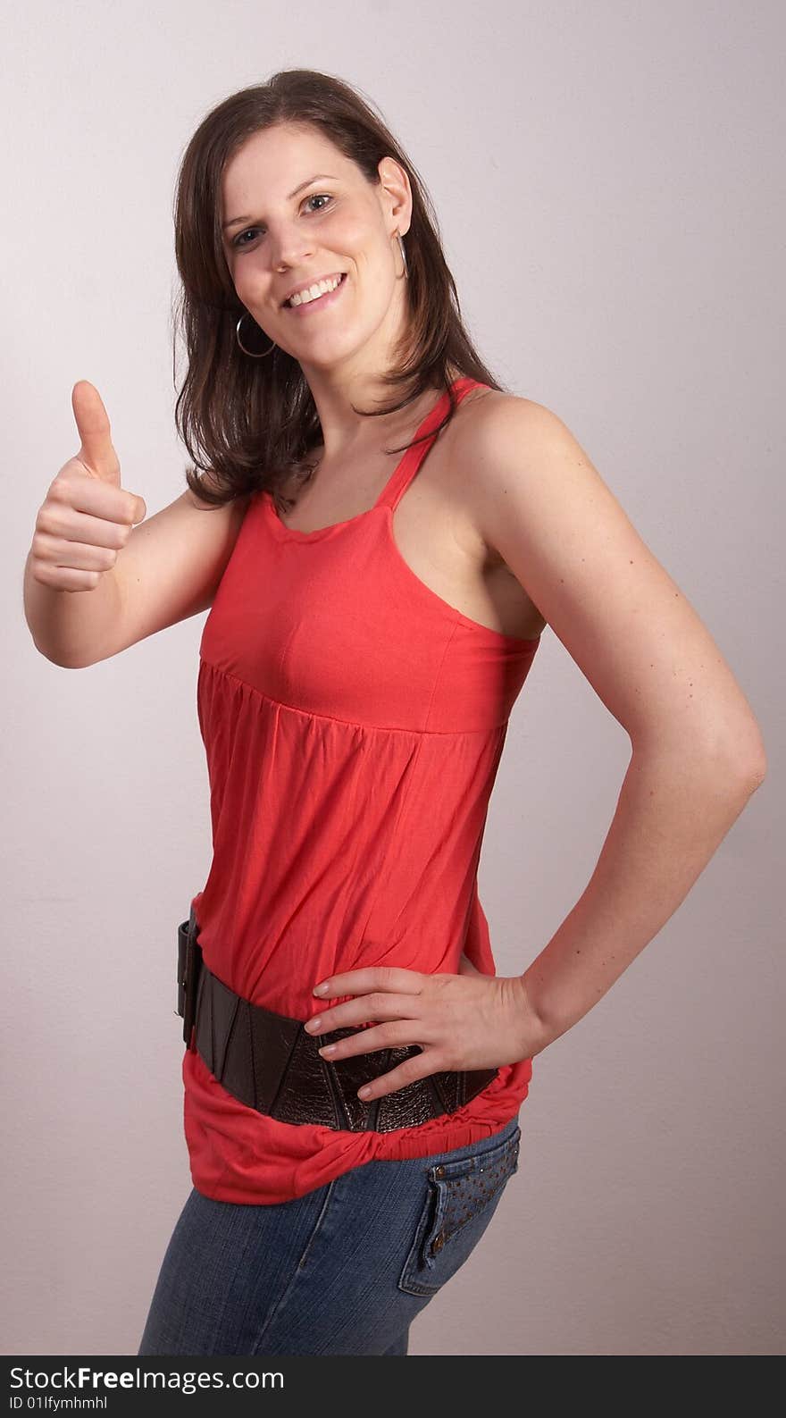 Young sexy woman is showing a thumb up sign.