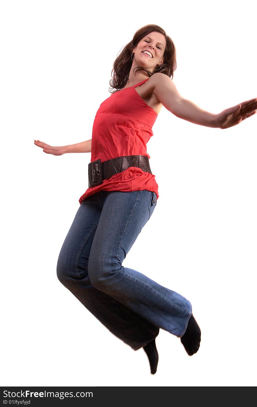 A young woman is jumping happy. Slight motion bluriness is intended! Isolated over white. A young woman is jumping happy. Slight motion bluriness is intended! Isolated over white.