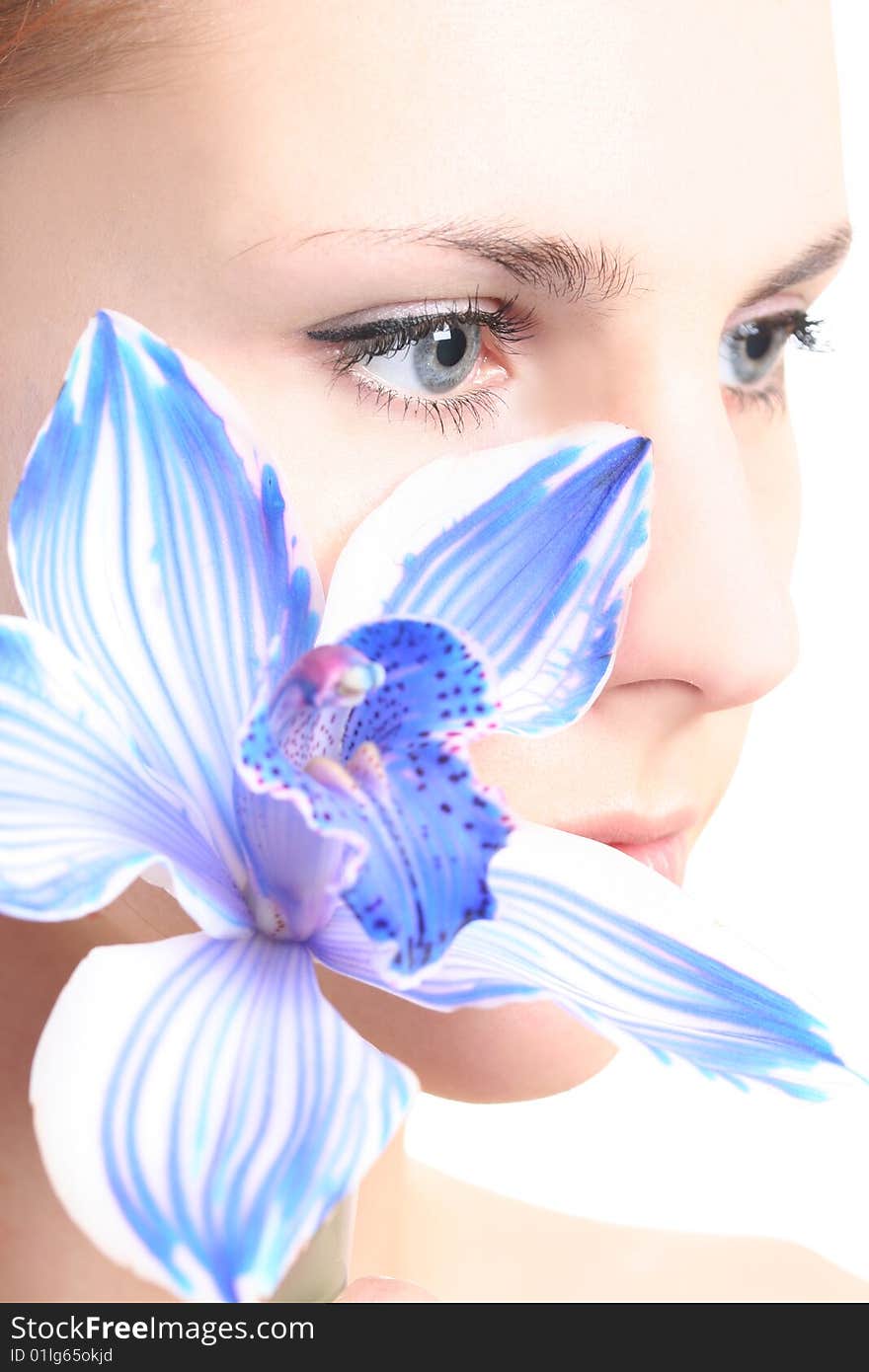 Young girl with blue orchid. Young girl with blue orchid