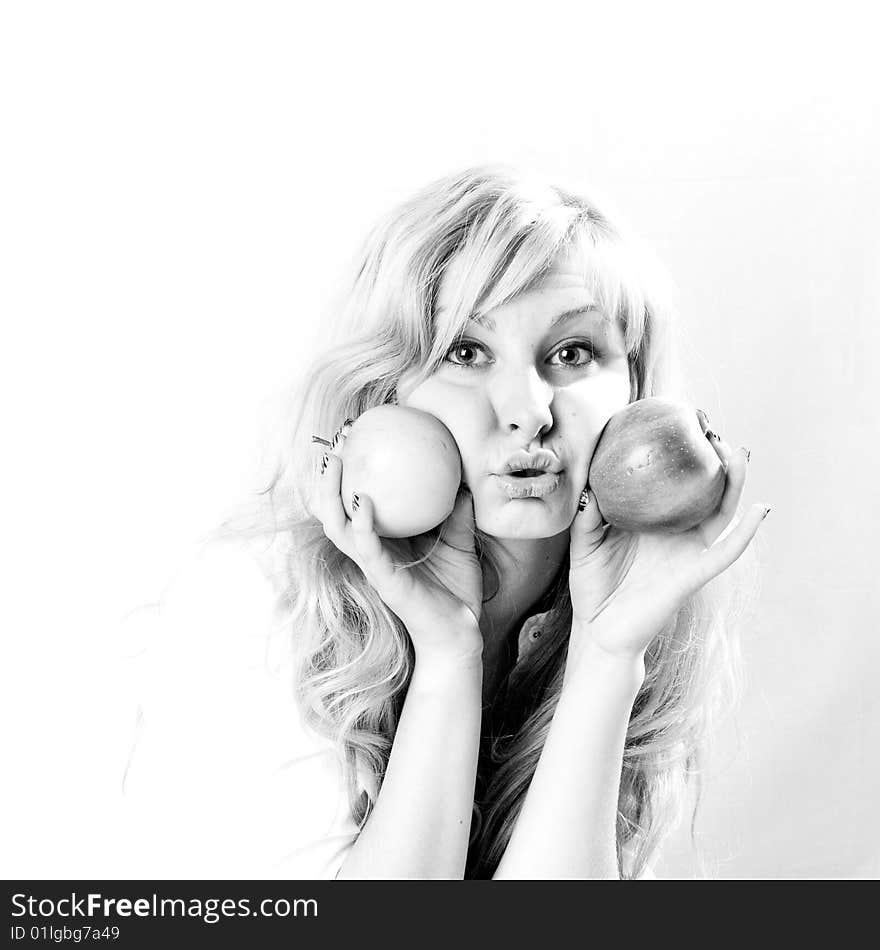 Portrait of a young blonde girl with apples in the white background. Portrait of a young blonde girl with apples in the white background