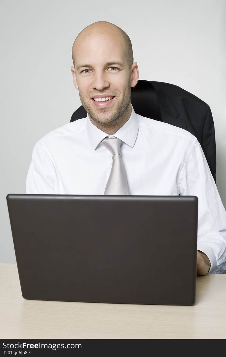 Young businessman with silver tie. Young businessman with silver tie