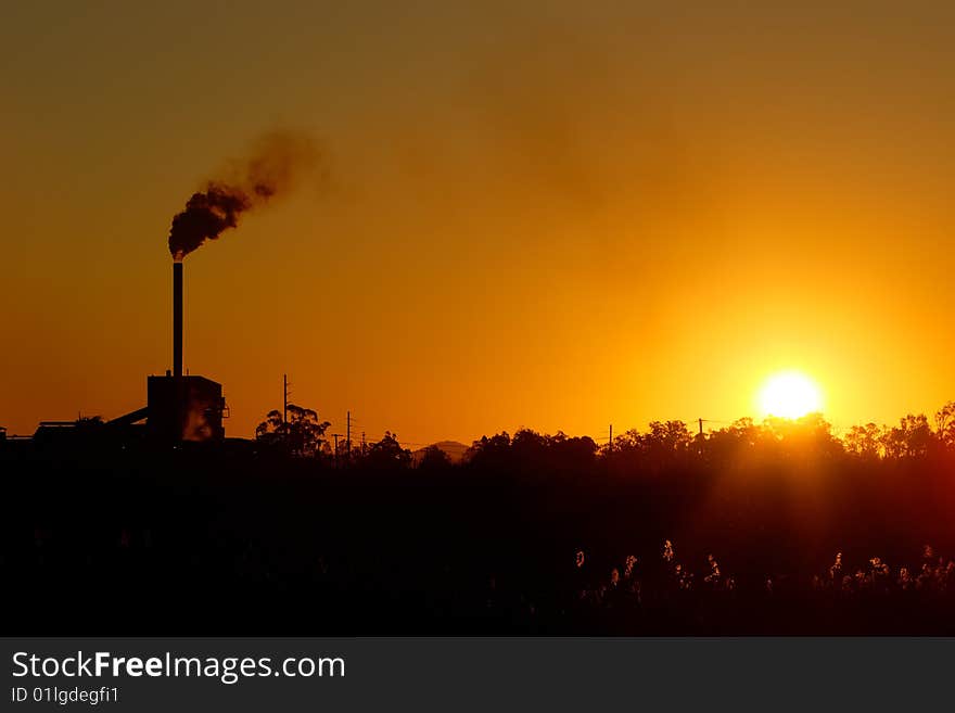 Environmental Struggle between Sunset and Factory