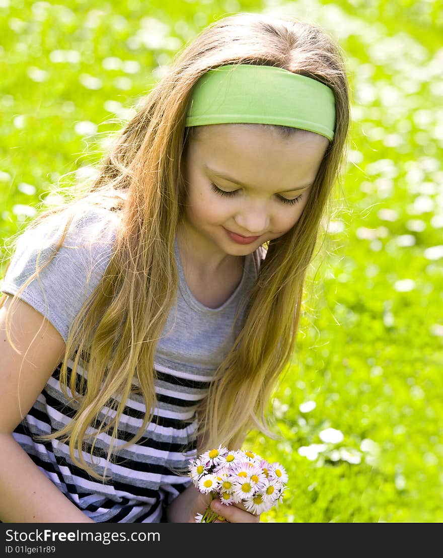 Young girl on field full of daisies