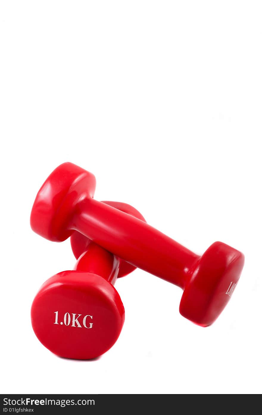 Two dumbbells against a white background. Two dumbbells against a white background