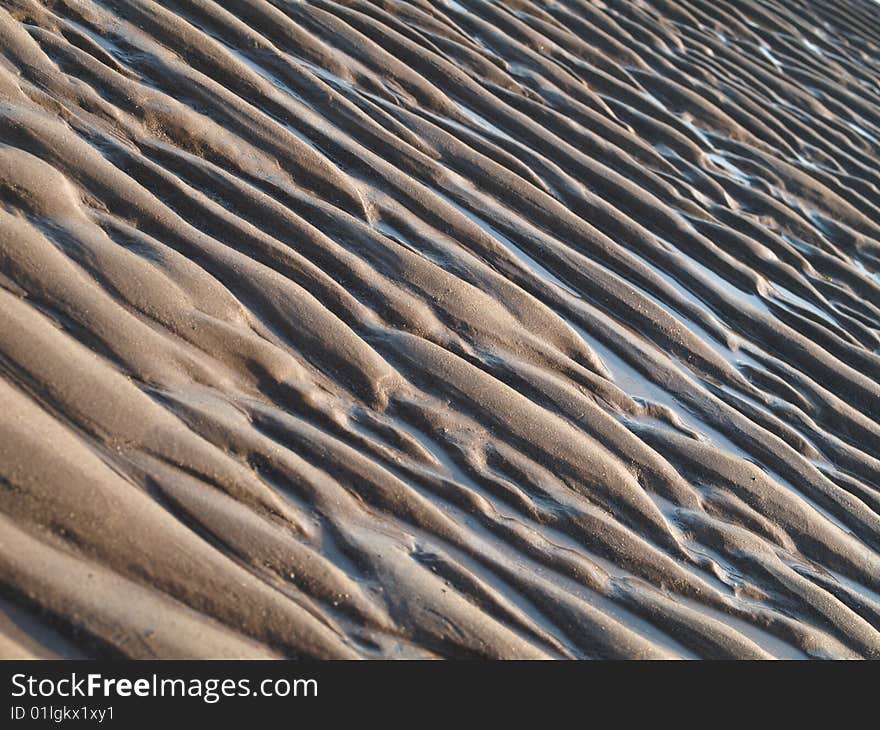 Sand pattern background after an outflow. Sand pattern background after an outflow.