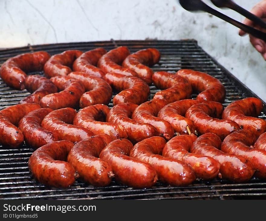 Fried sausages combined abreast at fair