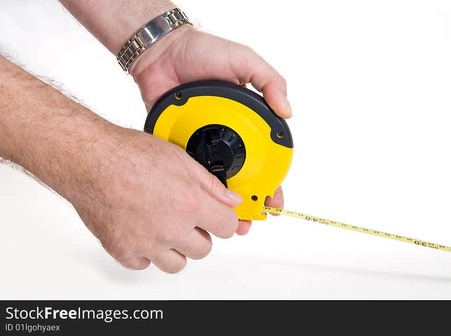 Hands holding flexible measuring tape, on white background