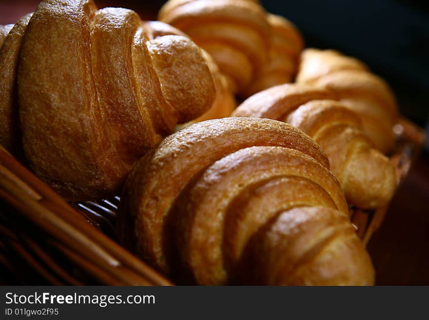 Fresh croissant on a basket. Fresh croissant on a basket