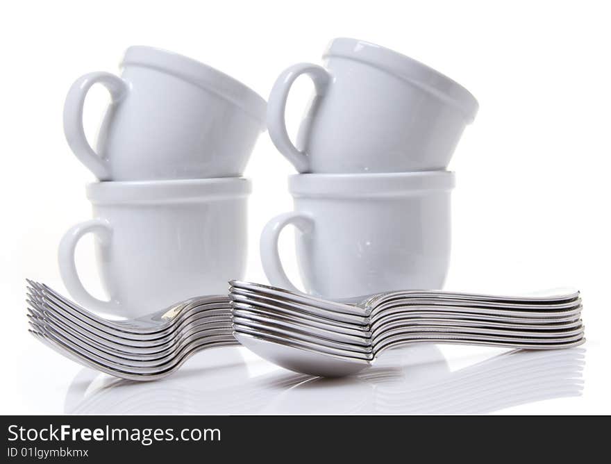 Cups and silverware stacked and ready for serving. Cups and silverware stacked and ready for serving