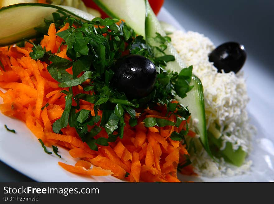 Close up salad with vegetable on white plate