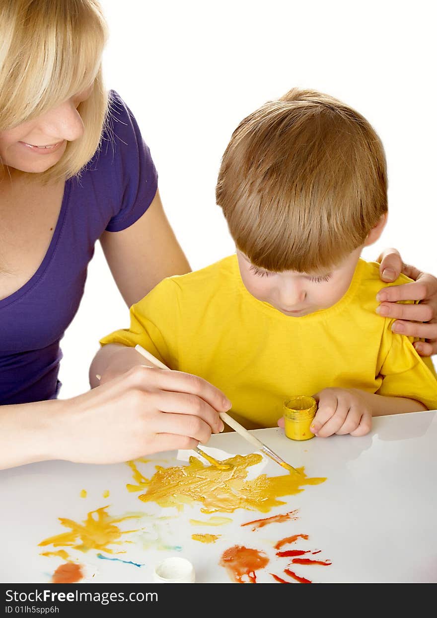 Young mum draws with the son paints. Young mum draws with the son paints