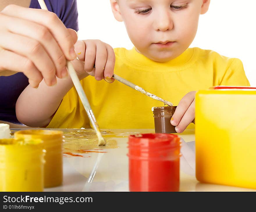 Mum draws with the son paints. Mum draws with the son paints