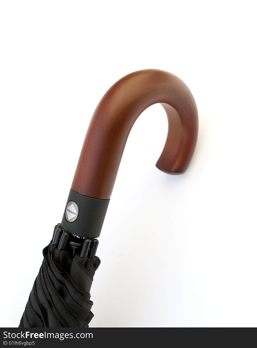 A black umbrella with wooden handle on white background. A black umbrella with wooden handle on white background