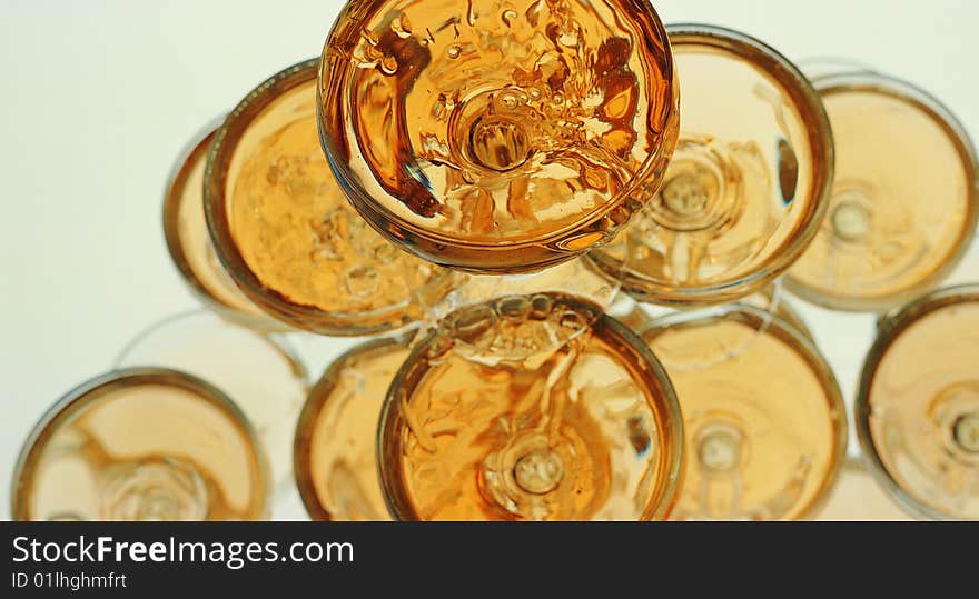 Close-up of pyramid from glasses with champagne on table. Close-up of pyramid from glasses with champagne on table