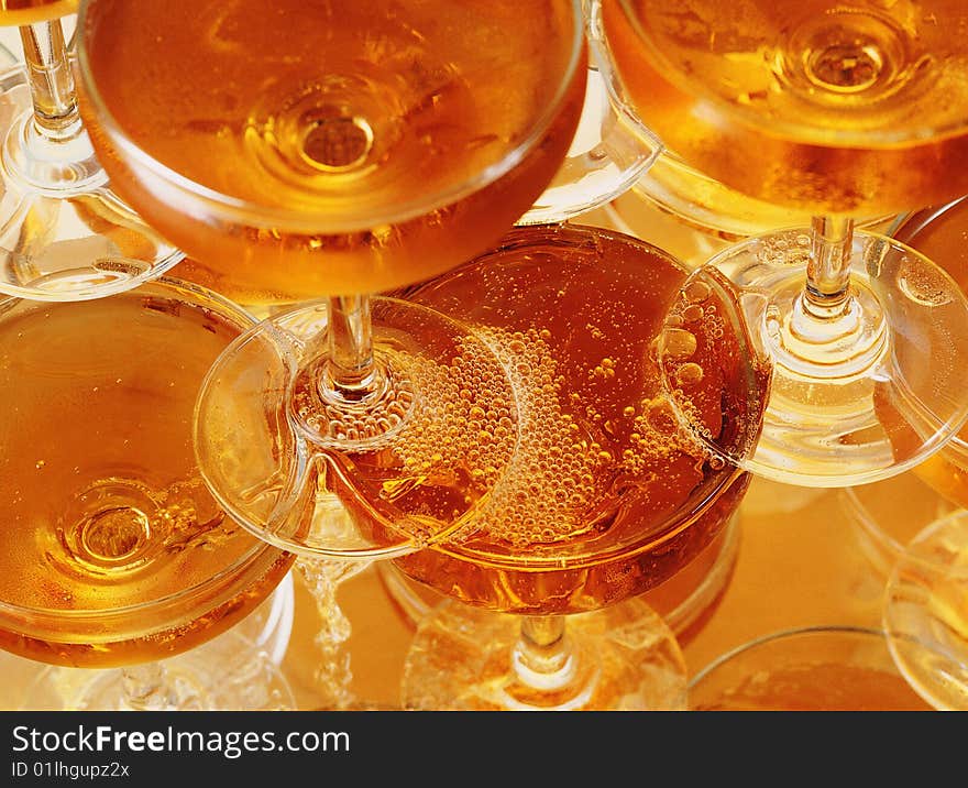 Close-up of pyramid from glasses with champagne . Close-up of pyramid from glasses with champagne