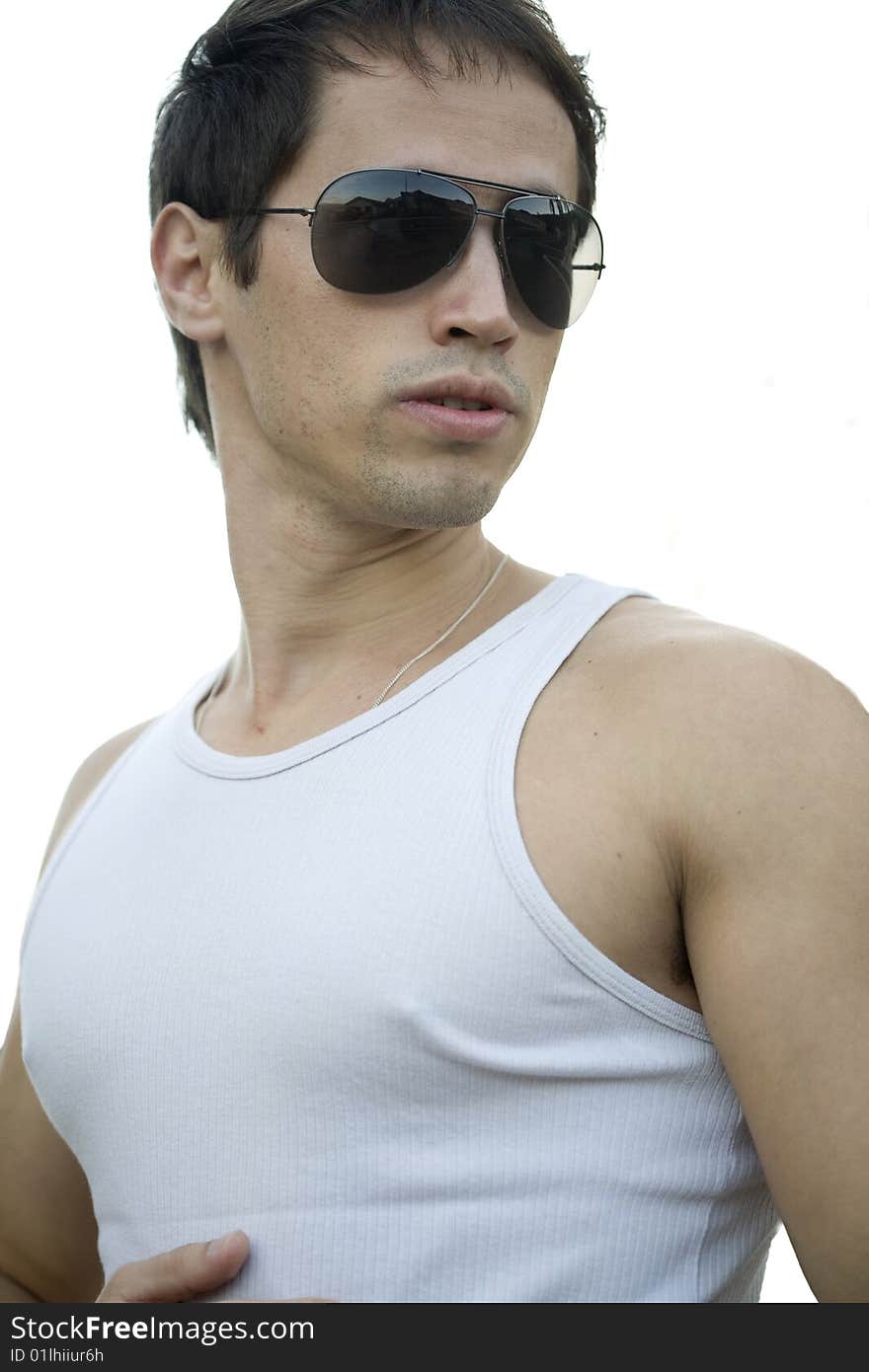 A young male model from Brazil in outdoors photograph,with aviator sunglasses. A young male model from Brazil in outdoors photograph,with aviator sunglasses.