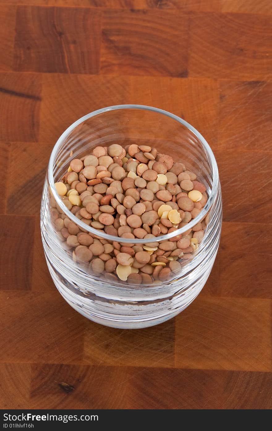 Lentils in Glass on wooden table