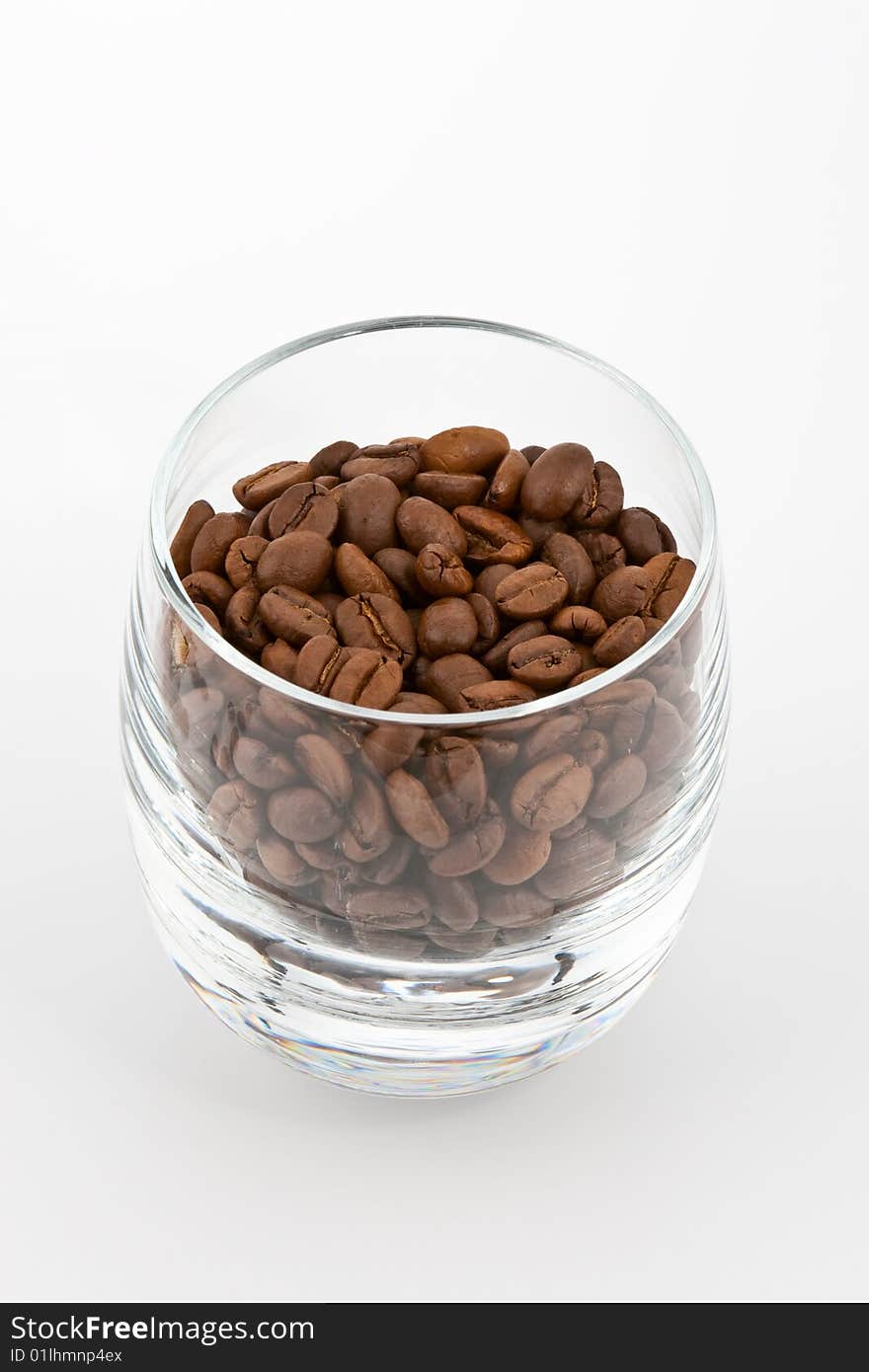 Coffea beans in glass on white background